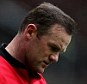 Head down: Rooney appears dejected after Liverpool took a one-goal lead