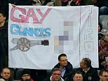 Controversial: Bayern Munich fans display a homophobic banner before kick-off against Arsenal