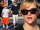 Youthful Reese Witherspoon, 37, shows off her trim figure in workout gear as she enjoys a stroll with son Deacon