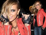 Reow! Carmen Electra channels Catwoman with feline eyes and head-to-toe leather at infamous rock 'n roll hotspot