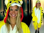 Purrrfect! Bar Refaeli celebrates Purim by masquerading in a bright yellow tiger suit... which she teams with a Chanel handbag