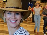 Victoria's Secret model Candice Swanepoel manages to make high-waisted jeans look good as she shows off her long legs in Cape Town