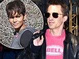 He is STILL wearing his wedding ring:  Olivier Martinez happily shows off his wedding ring in the face of marriage split rumours, as he flies out of Los Angeles alone