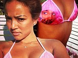 Get a look at this! Karrueche showed off her cleavage in a Cam'Ron bikini on Sunday