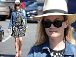 Not sure what to focus on: Reese Witherspoon teamed many eye-catching pieces together as she stepped out in Brentwood in Los Angeles on Monday