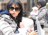 'Costume change!' Hilaria Baldwin slips into winter wear as she bonds with baby Carmen after posting sultry bedroom yoga snap
