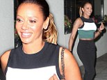 Still got it! Mother-of-three Mel B bares her midriff in cropped top on romantic dinner date with husband Stephen Belafonte