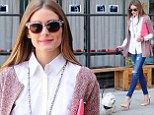 Olivia Palermo looks stylish as she walks her dog, Mr Butler, out and about in New York