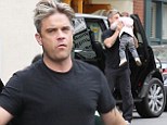 He's got his little Angel! Robbie Williams carries his adorable daughter Theodora Rose to the car after afternoon together