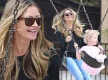 A whole new level! Rebecca Gayheart taps into her inner child and enjoys a Saturday with her young daughters playing on a swing set