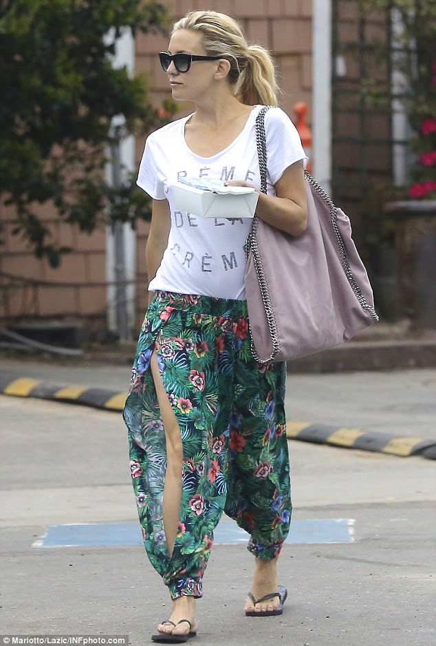 Tropical delight! The pretty 34-year-old actress wore billowing jungle print pants with a sizeable slit showing off her leg as she carried takeout away from the restaurant