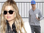 Honey I'm home! Fergie arrives back in Los Angeles following trip to Washington D.C.  as Josh Duhamel bides his time draining liquid from knee