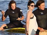 Daddy's little girl! Kylie Jenner runs her father Bruce a packed lunch after he struggles to master the sport of paddleboarding