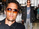 Mahola, dude! Matthew McConaughey shows off his American pride while departing from LAX in a scruffy and inconspicuous outfit