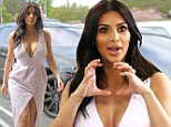 Kim Kardashian cuts a triumphant figure in plunging dress as she emerges for first time since magazine news