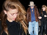 They're inseparable! Johnny Depp grips fiancee Amber Heard's hand as they hit NYC together