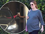 Indulging the cravings? Heavily pregnant Drew Barrymore grabs an ice-cream from a McDonalds drive-thru