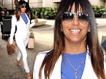 White hot! Eva Longoria shows off svelte physique and taut derriere in a stylish white ensemble