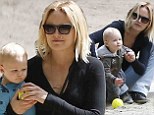Come slide with me! Malin Akerman dotes on son Sebastian while playing at jungle gym in practical and comfortable apparel