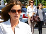 Double trouble! Cindy Crawford stays in step with her lookalike daughter Kaia Gerber as they don mismatching outfits