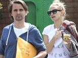 Kate Hudson and fiance Matt Bellamy put on a united front as they hit the beach together for the second day in a row