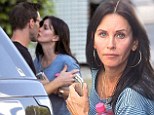 Sneaky smooch: Courteney Cox and Johnny McDaid enjoyed a kiss on the lips in Los Angeles on Thursday