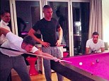 Pretty in pink: Arsenal stars are focused on the pool table
