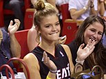 Heating up Miami! Nina Agdal enjoys the basketball in her team shirt at a game on Friday night