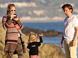 Kate Hudson and Matt Bellamy on 'the rocks'... as they put split rumours behind them with family day at the beach