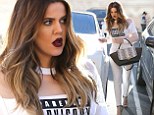 Making a statement: Khloe Kardashian wore a 'PARENTAL ADVISORY EXPLICIT CONTENT' shirt as she grabbed frozen yoghurt with her sister Kim on Thursday