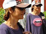 Pucker up! Lisa Rinna goes make-up free as she shows off her huge plumped lips ... adorned across her shirt