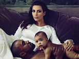 The big reveal! A shirtless Kanye West cradles baby North West as they rest upon Kim Kardashian in the inside spread of Vogue Magazine