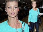 Joanna Krupa shows off her long legs in tight skinny jeans as she makes a cool arrival into Los Angeles