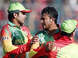 Destroyer: Bangladesh's Shakib Al Hasan (second left) took 3-8 in the World Twenty 20 against Afghanistan