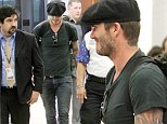 Casual attire: David Beckham dressed down in a black T-shirt and jeans combination as he departed Miami following a few days of business meetings