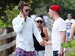 Well, this is awkward: Patrick Schwarzenegger and Jason Kennedy accidentally ended up holding hands when they bumped into each other in Miami, Florida, on Saturday
