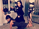 Hilaria Baldwin and lingerie designer Dita Von Teese posted a playful yoga pose Sunday on Instagram