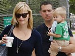Reese Witherspoon goes casual in comfy printed trousers as she jets out of Miami with her brood for a family holiday