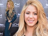 That's very eye-catching! Shakira spins a sexy web of glamour in teal green cut out gown at the ACM Awards