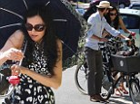It's a dog's life: Famke Janssen and her boyfriend Cole Frates went on a romantic bicycle ride on Saturday with her pet pooch Licorice