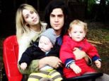 Happier times: The model and journalist is pictured with her sons and husband, Thomas Cohen