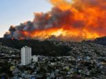 A view across Valparaiso showing scores of houses on fire. Authorities decreed a red alert for the area after the forest blaze consumed 100 houses in seconds
