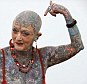 Standing proud: At 77, Isobel Varley is the most tattooed senior in the world, and she claims she doesn't regret a single one her elaborate inkings