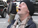 In bliss! Richard Gere seems to have finally found nirvana as he pretends to urinate on the street in New York