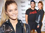 She's got him beat! Model Nina Agdal flexes her muscles in stylish workout gear at charity cycling event with Jeremy Piven