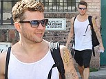 It's definitely paying off! Ryan Phillippe showcases his bulging and tattooed biceps as he leaves the gym