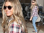 Check out this body! New mom Fergie cuts a super slim figure in plaid shirt and skinny jeans on solo trip