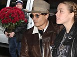 Birthday books: Johnny Depp had a red rose for birthday girl Amber Heard on Tuesday as they arrived at a bookstore in New York City
