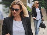 Kate Moss steps out in ripped denim