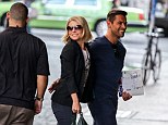 Loved up couple: Kelly Ripa and Mark Consuelos couldn't keep their hands off each other while out and about in New York City on Monday